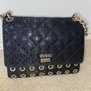 Guess Black flap crossbody purse
Black and gold